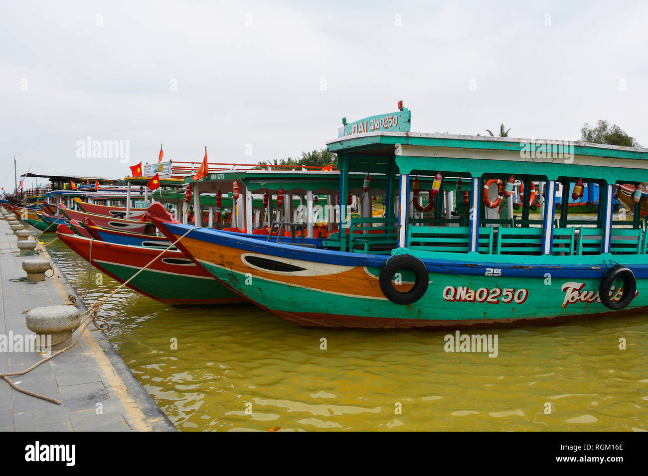 Hoi An, VietnamDecember 20th 2017. Old wooden boats wait for tourists