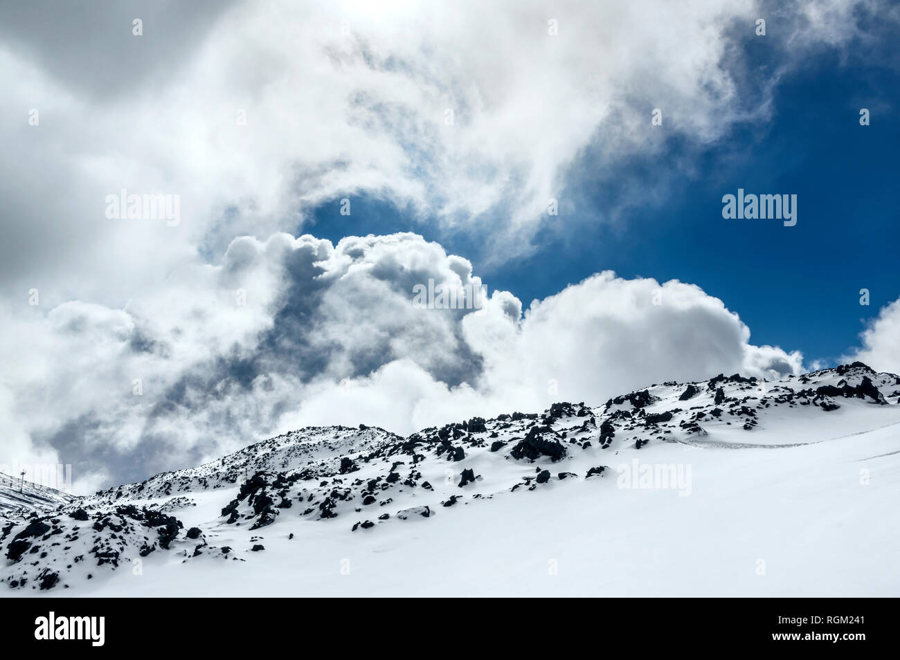 Cloud On Ridges Curly clouds showing behind volcano ridge Stock Photo - Alamy