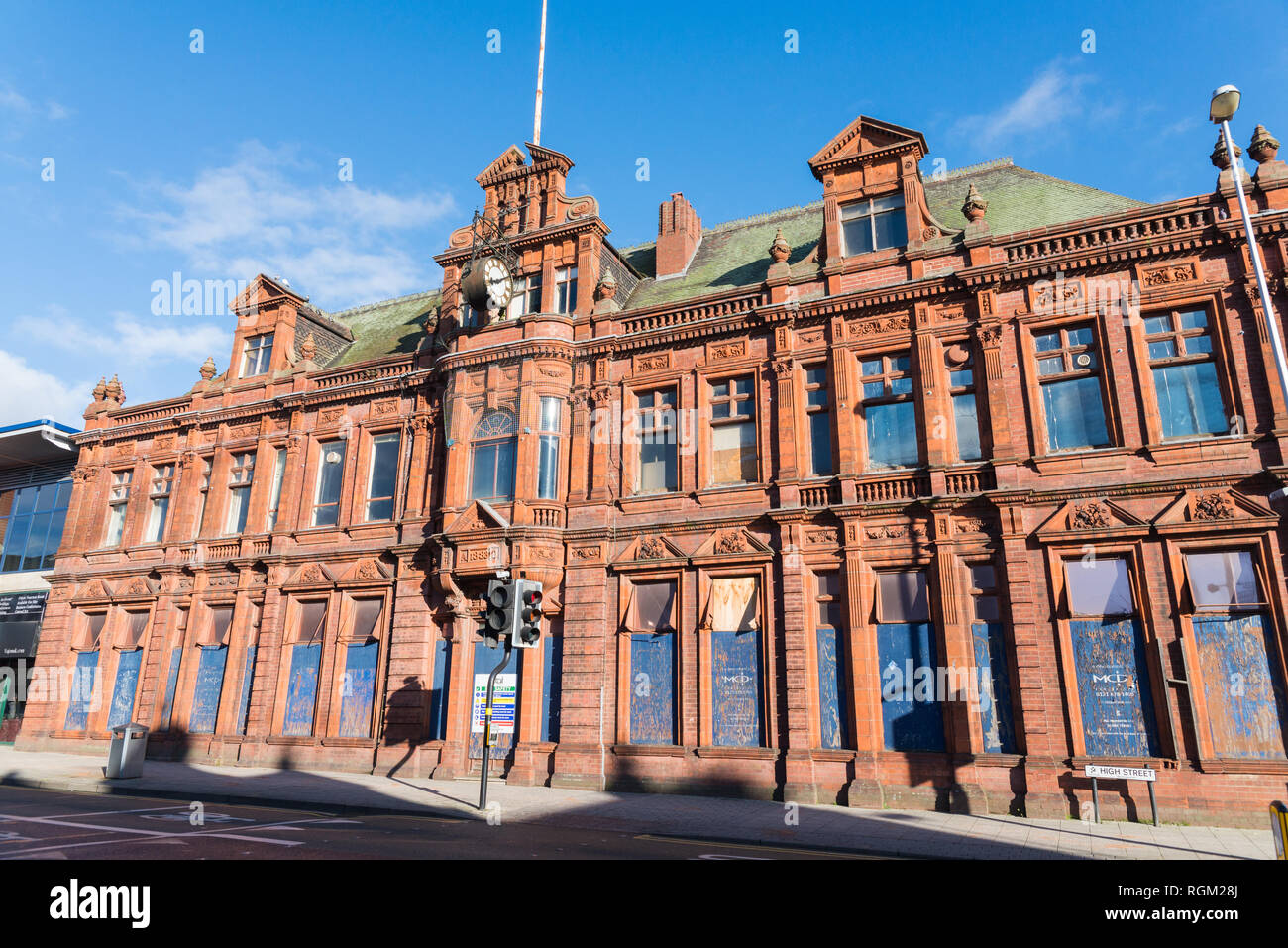 Boarded up majestic red brick large Victorian building in West Bromwich High Street Stock Photo