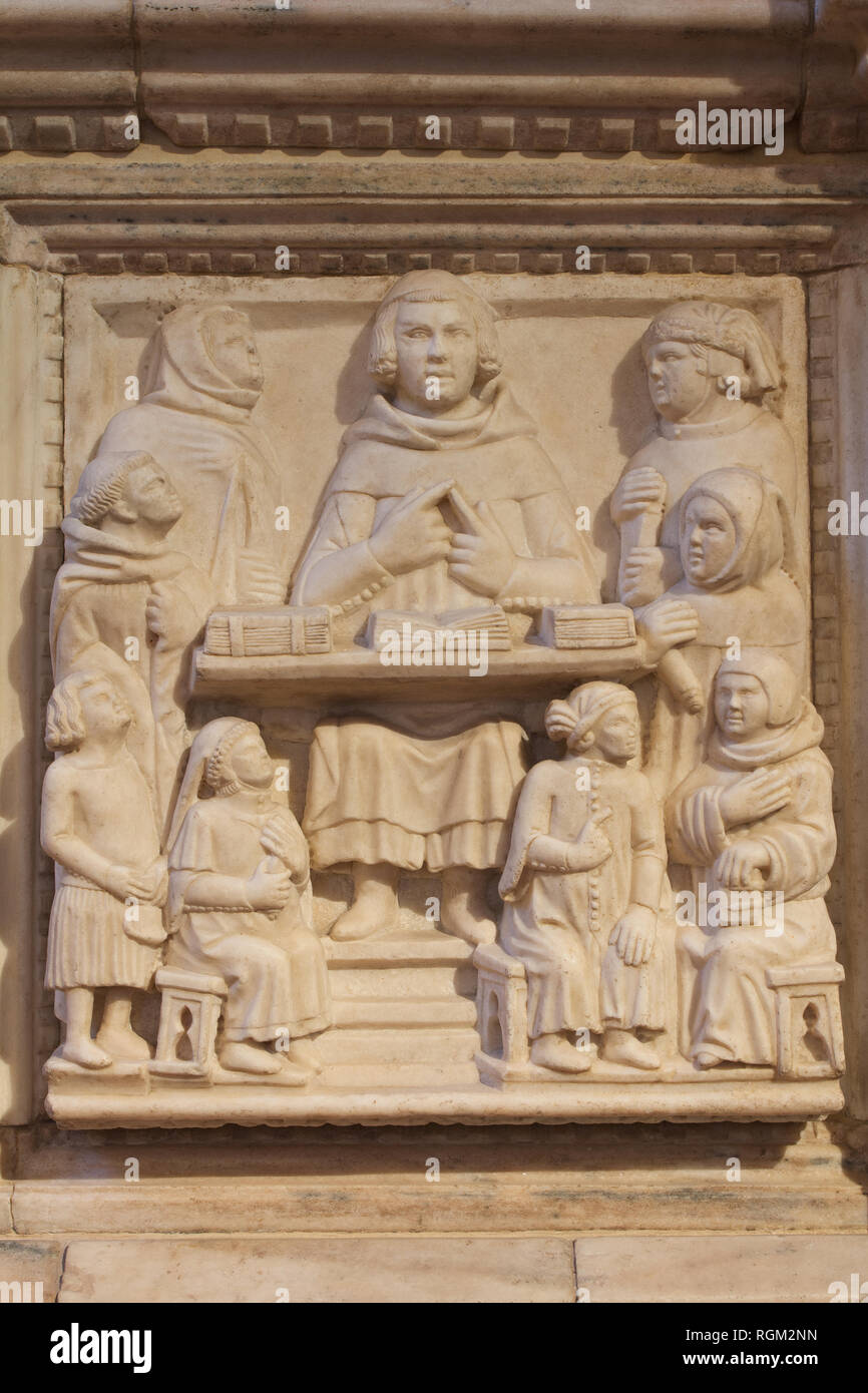 A medieval Teacher with pupils - Detail of the Aliprandi's sarcophagus (by Maestri Campionesi, 14th C) - Church of san Marco - Milan Stock Photo