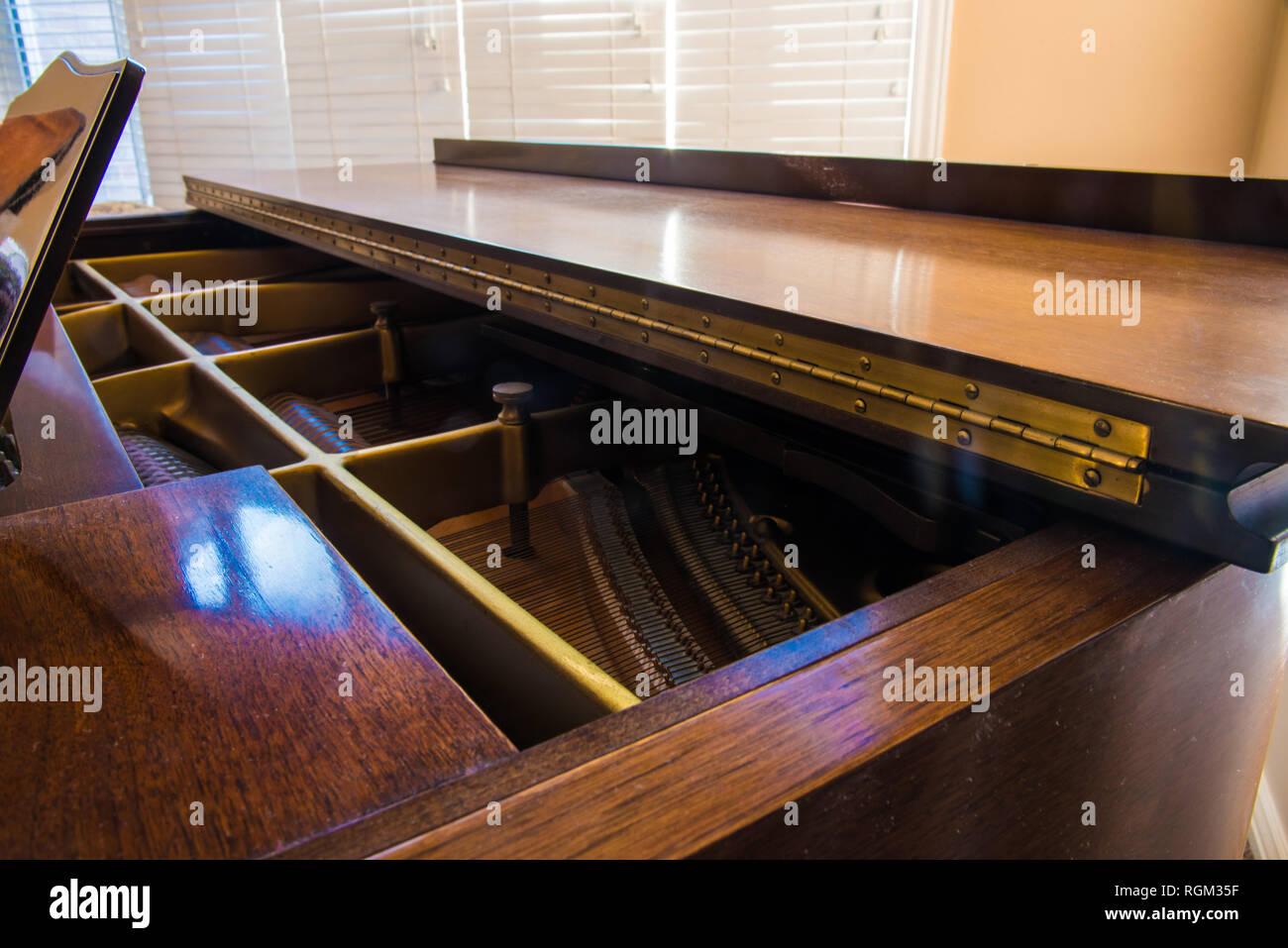 Piano hinge and sound board on a grand piano. Stock Photo