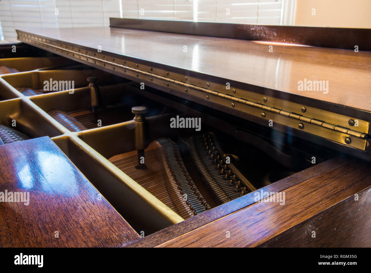 Piano hinge and sound board on a grand piano. Stock Photo