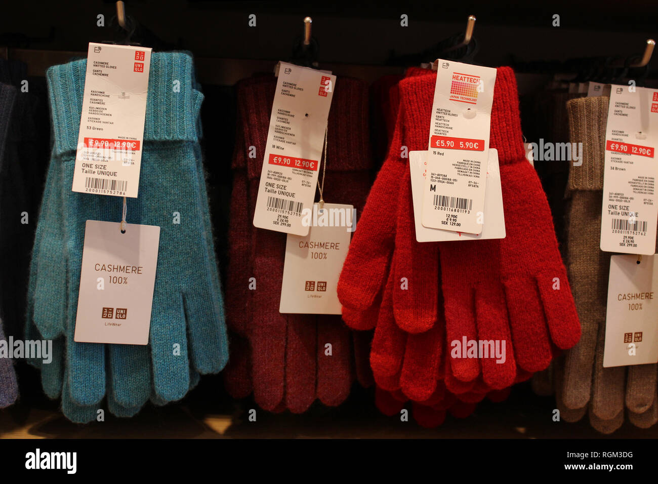 Uniqlo cashmere gloves displayed with price tags, close-up Stock Photo -  Alamy
