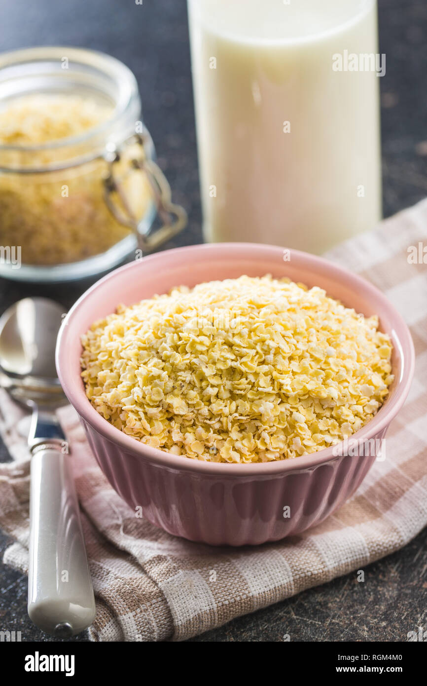 Healthy millet flakes in bowl Stock Photo Alamy