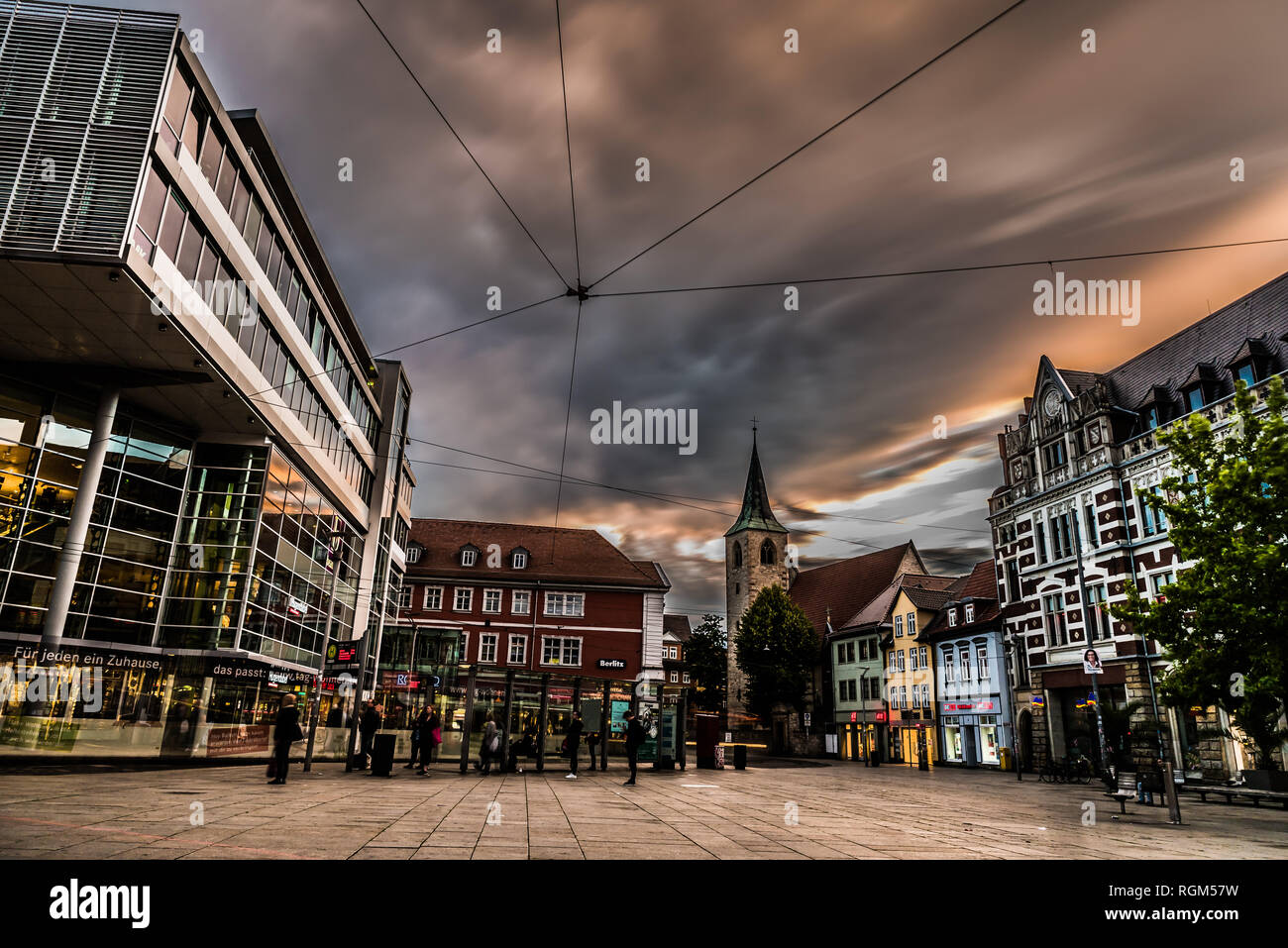 Erfurt, Germany - 07 27 2017: Evening view of the Anger shopping square with people waiting for the tram Stock Photo