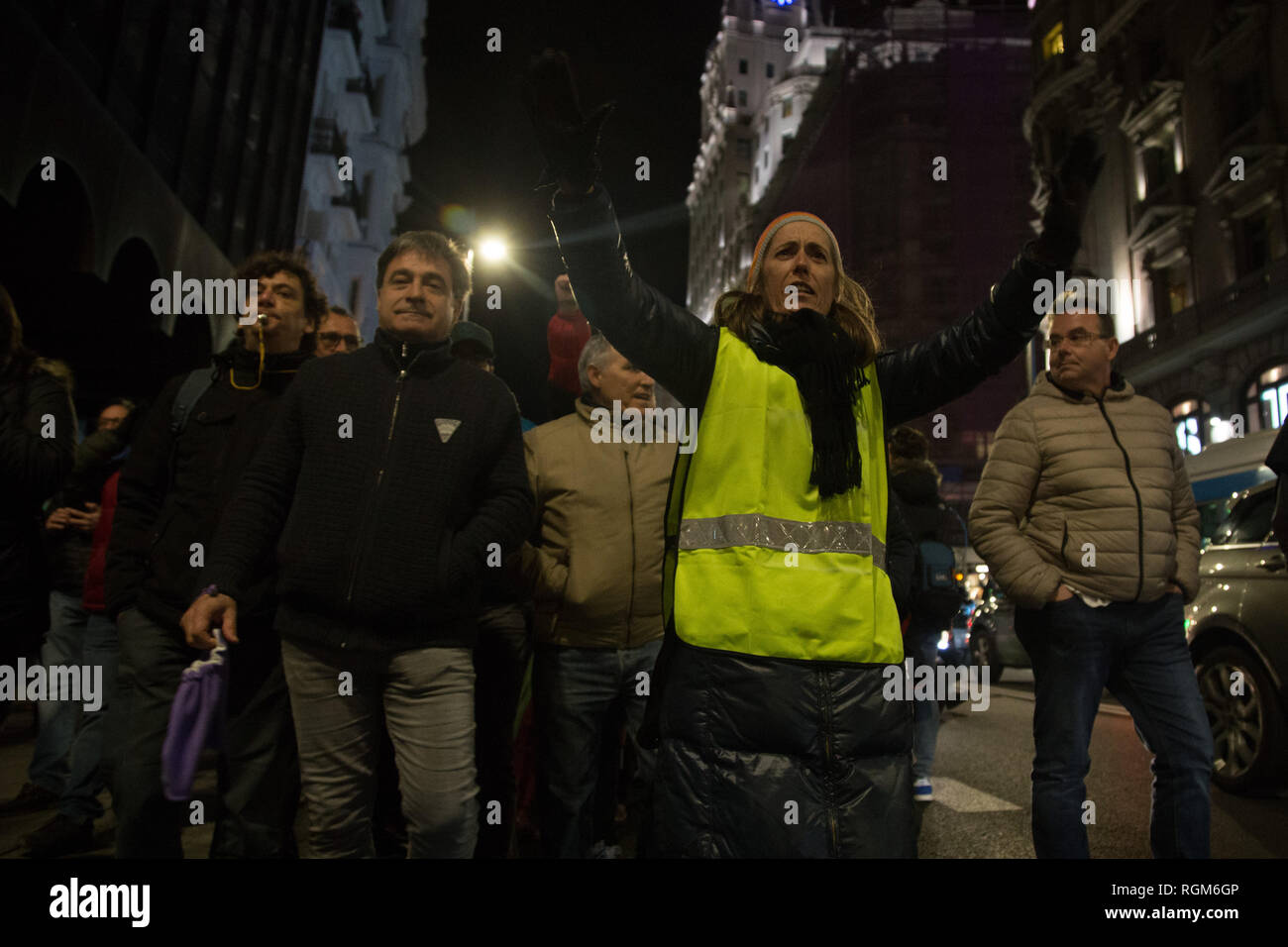 Madrid, Spain. 29th Jan, 2019. A taxi driver seen raising his hands after occupying the Gran Via during the strike.Thousands of taxi drivers continue with the strike in Madrid to demand for more stringent regulation for rental vehicles with drivers (VTC), who use Uber or Cabify applications. Credit: Lito Lizana/SOPA Images/ZUMA Wire/Alamy Live News Stock Photo