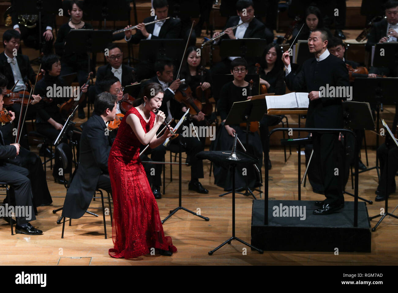 Brussels, Belgium. 29th Jan, 2019. Conductor Tan Dun (R), suona player Liu  Wenwen (L) and other members perform the 100 Birds Flying Towards the  Phoenix during a Guangzhou Symphony Orchestra New Year