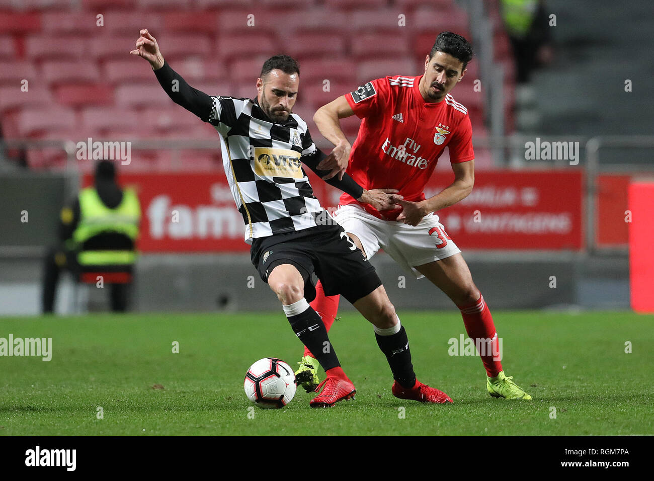 Rafa of Boavista FC (L) and André Almeida of SL Benfica (R) are seen in action during the League NOS 2018/19 football match between SL Benfica vs Boavista FC. (Final score; SL Benfica 5:1 Boavista FC) Stock Photo