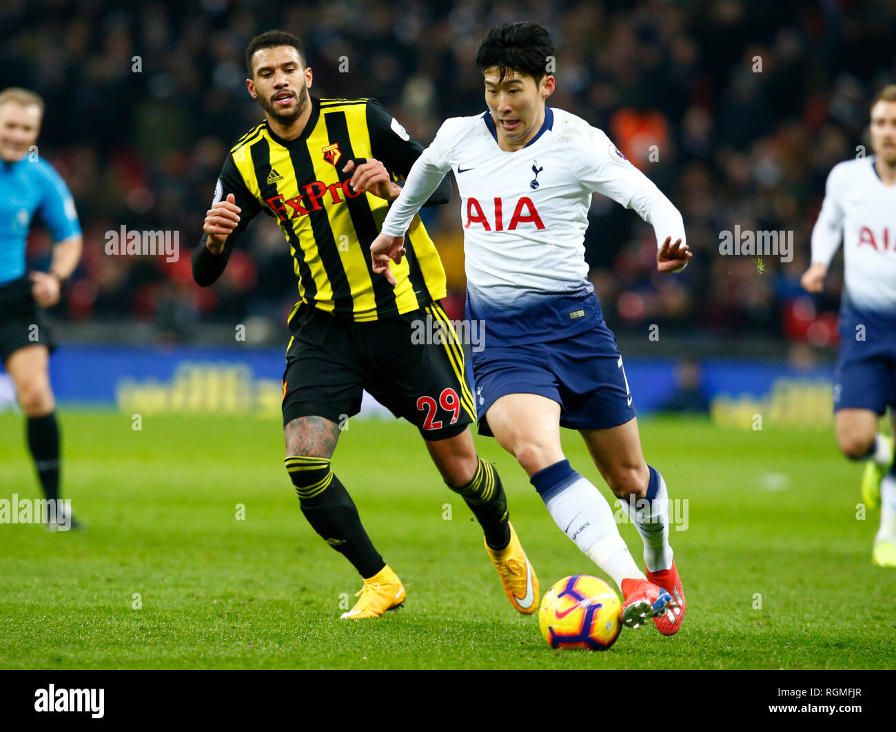 London, UK. 30th Jan, 2019. Tottenham Hotspur's Son Heung-Min beats Watford's Etienne Capoue during during English Premier League between Tottenham Hotspur and Watford at Wembley stadium, London, England on 30 Jan 2019 Credit: Action Foto Sport/Alamy Live News Stock Photo