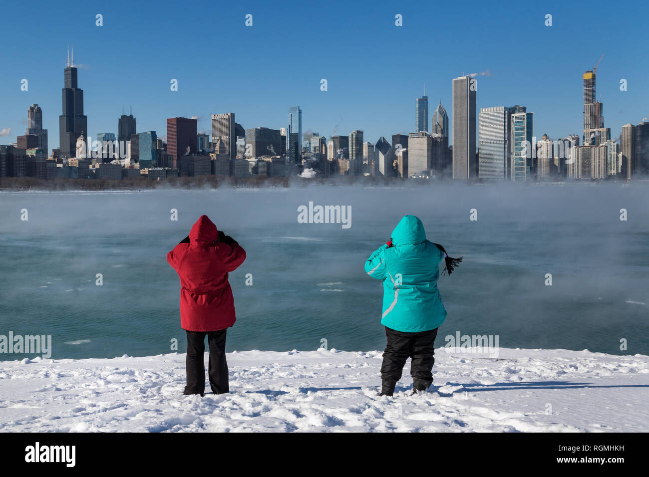 Chicago, USA. 30th Jan 2019. Despite the polar vortex and temperatures of 20 below zero some hardy folks ventured to Chicago's shoreline to see the unusual winter fog effect rising from the not yet frozen Lake Michigan Credit: Matthew Kaplan/Alamy Live News Stock Photo