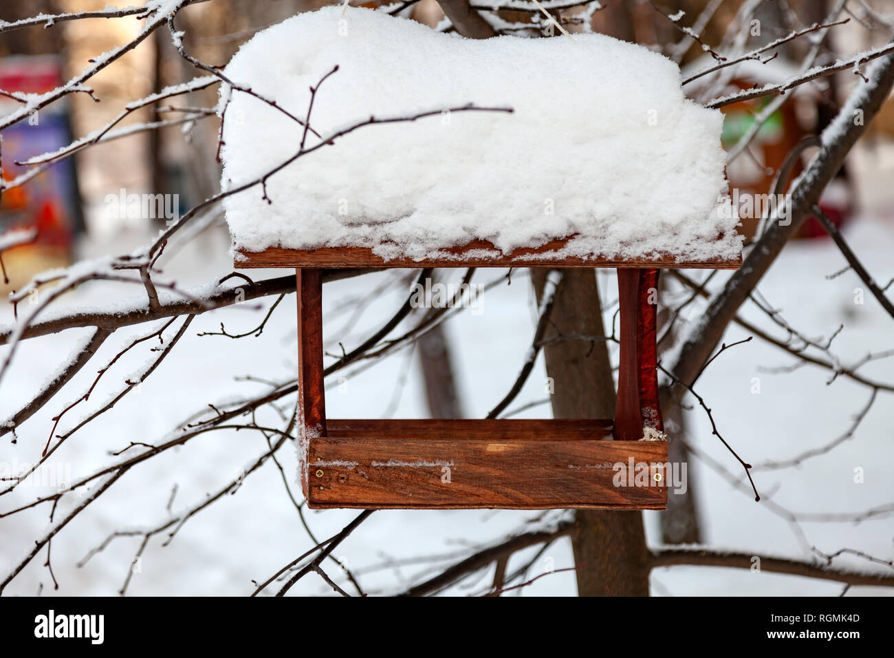 Close Up Of A Wooden Birdhouse Bird Feeder Covered With A Large