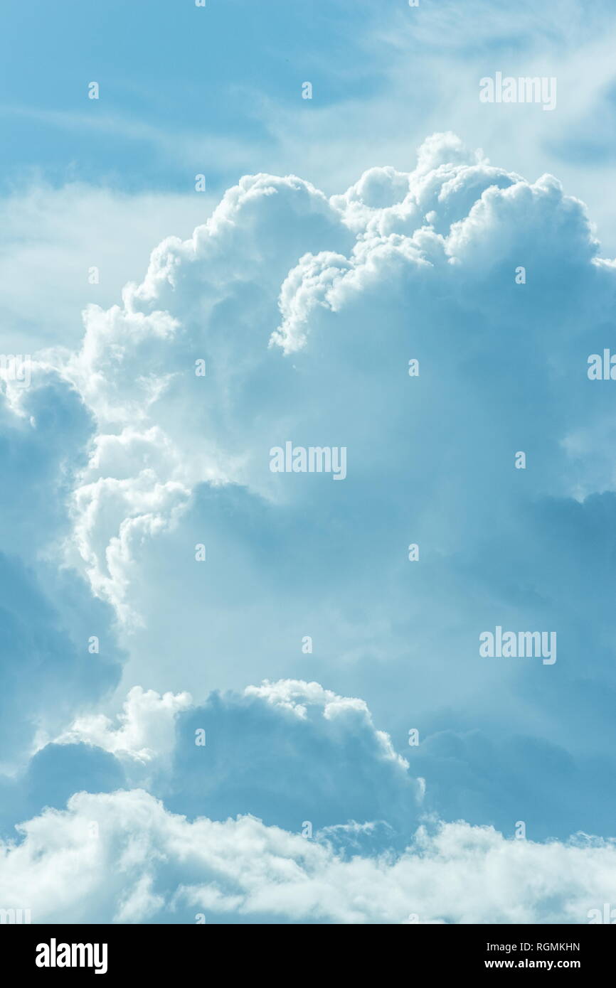 Background image of billowing storm clouds light blue Stock Photo - Alamy