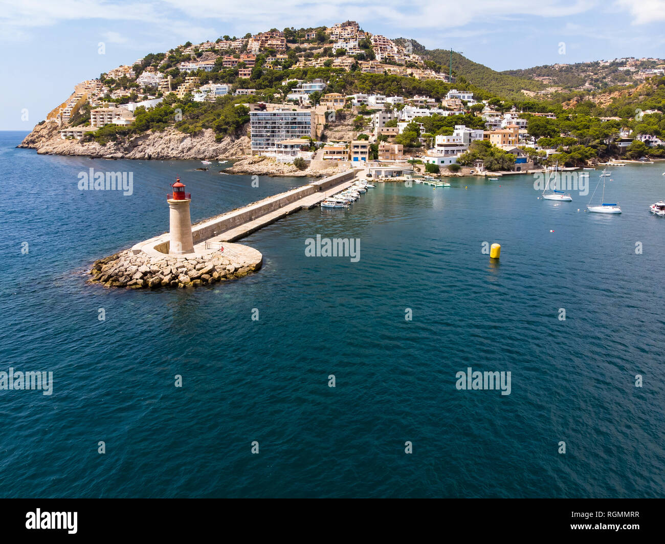 Spain, Balearic Islands, Mallorca, Andratx Region, Aerial view of Port d'Andratx, coast and natural harbour with lighthouse Stock Photo