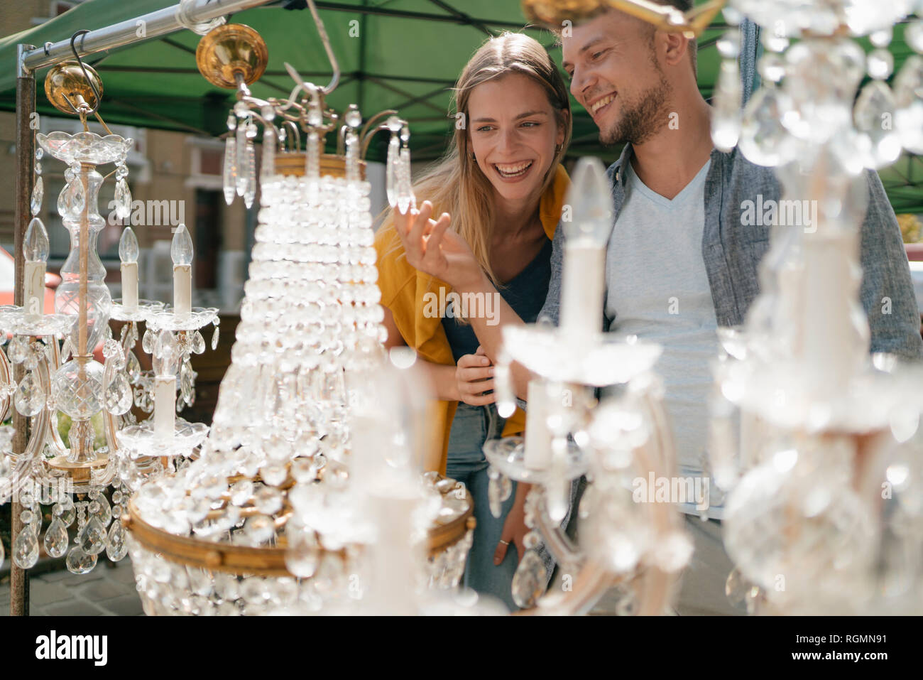Belgium, Tongeren, happy young couple on an antique flea market Stock Photo