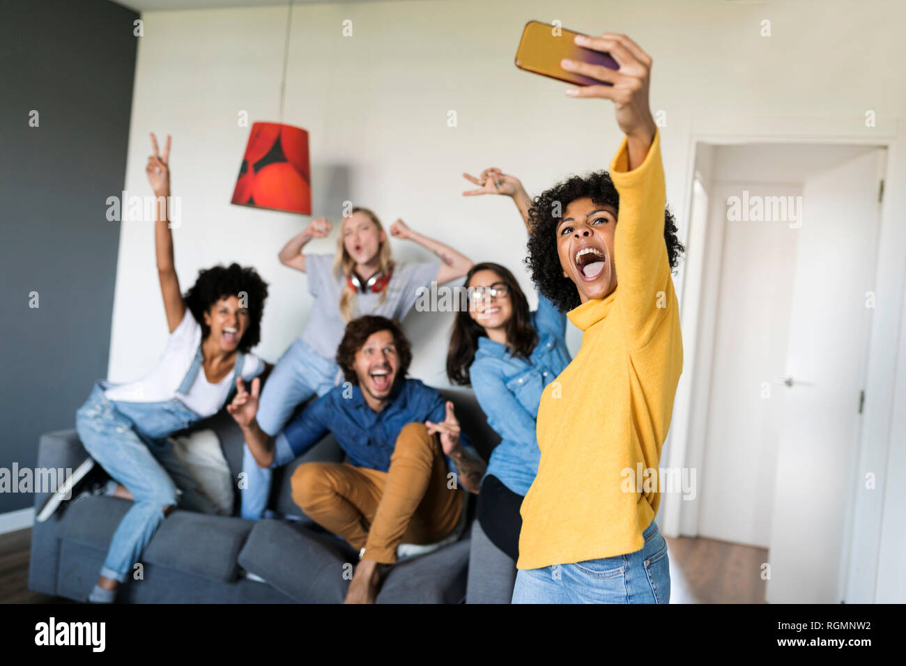 Cheerful friends taking a selfie at home Stock Photo