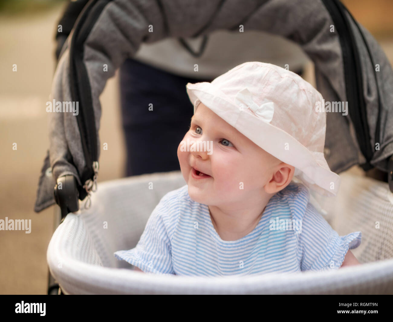 Portrait of relaxed baby girl in pram Stock Photo