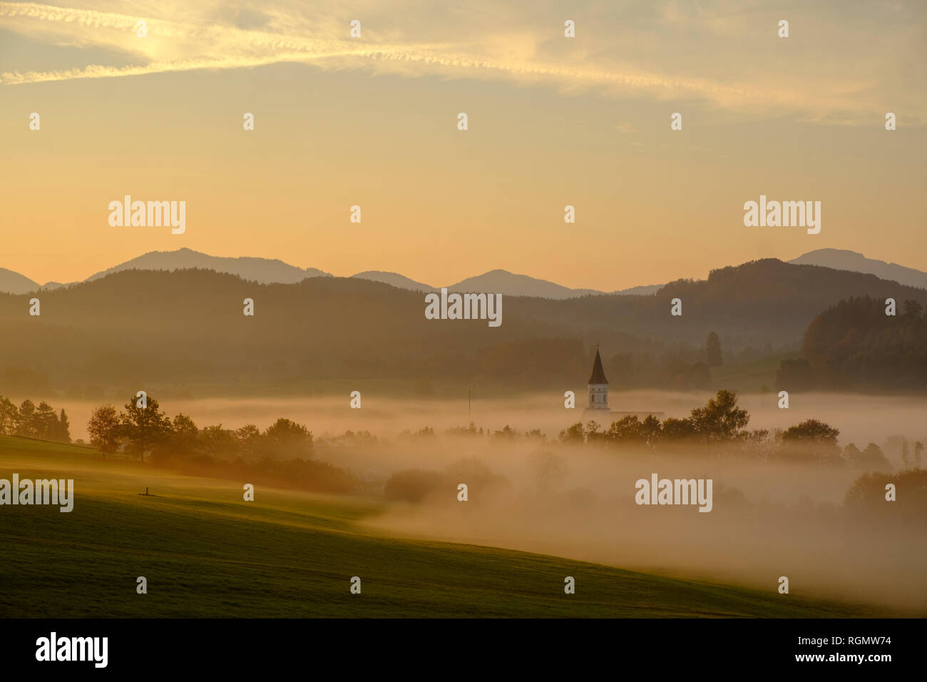 Germany, Pfaffenwinkel, view of landscape at morning mist Stock Photo