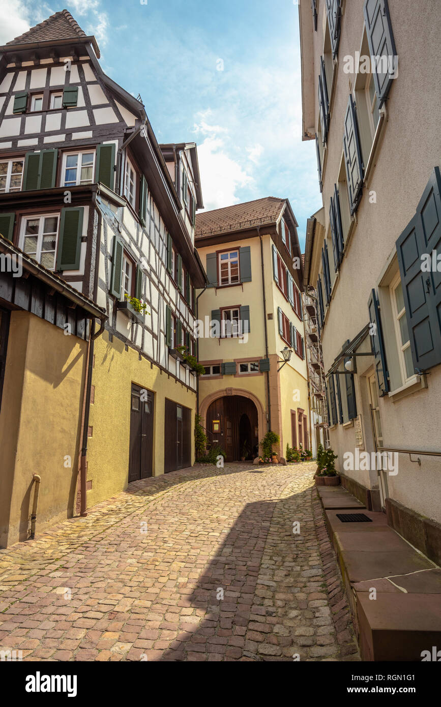 narrow lane with half-timbered houses and pavement, Black Forest, Germany, town Schiltach in the Kinzig valley Stock Photo