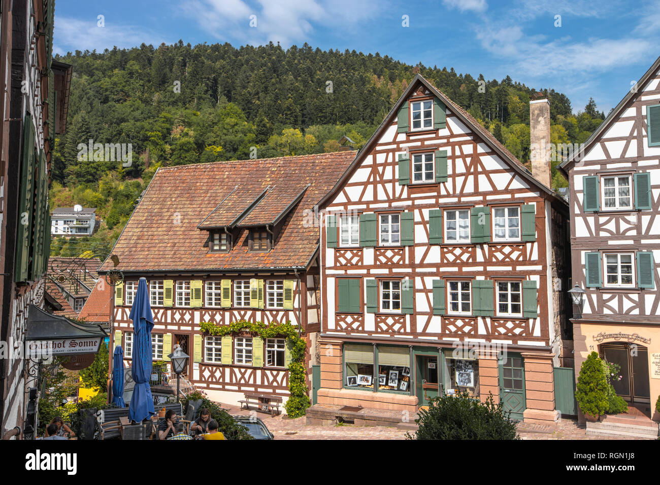 historical old town of Schiltach, Black Forest, Germany, picturesque half-timbered houses in the inner-city with mountain in background Stock Photo