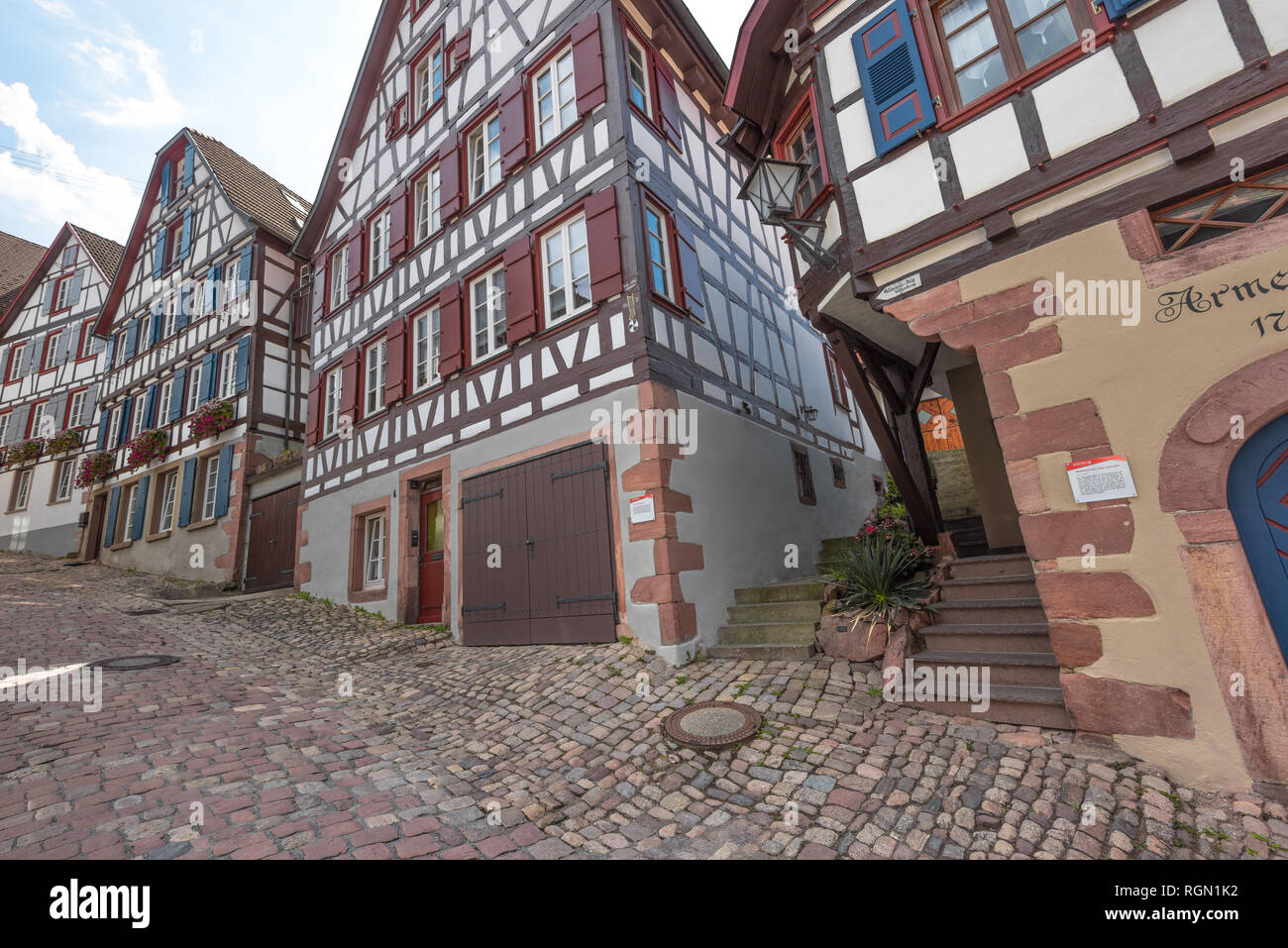 row of half-timbered houses, town Schiltach, Black Forest, Germany, cobblestone street of a historic medieval town Stock Photo