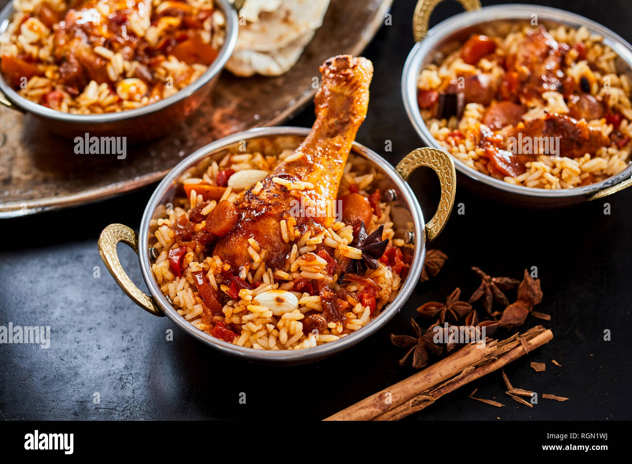 Individual servings of spicy Arabian kabsa with long grained rice