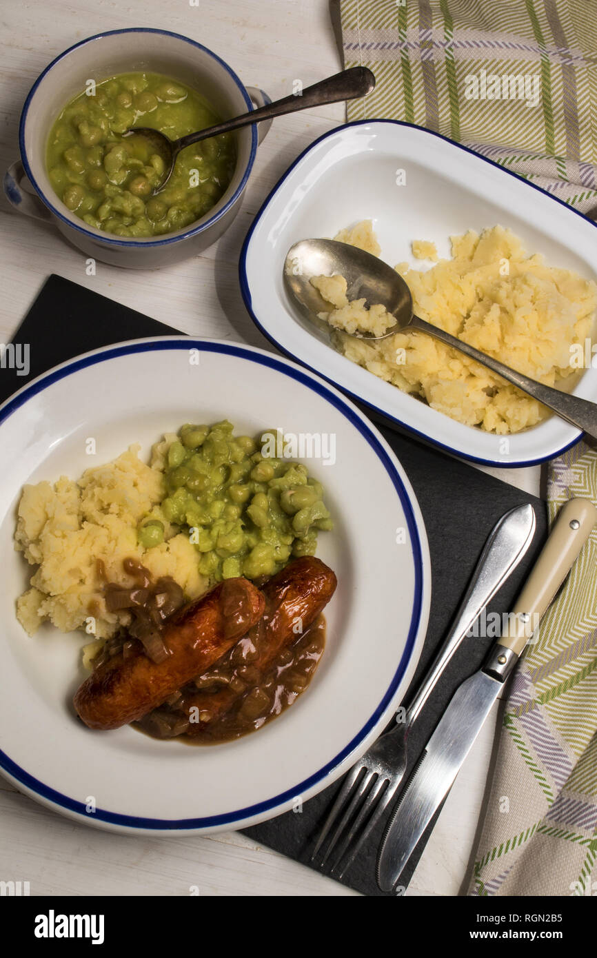 Very Typical Irish Dish Mashed Potato Onion Gravey Grilled Sausages And Mushy Peas Stock 