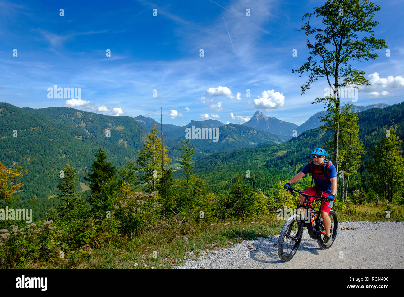 Austria, Tyrol, Juifen, Rotwand mountain pasture, mature men on mountain bike Stock Photo