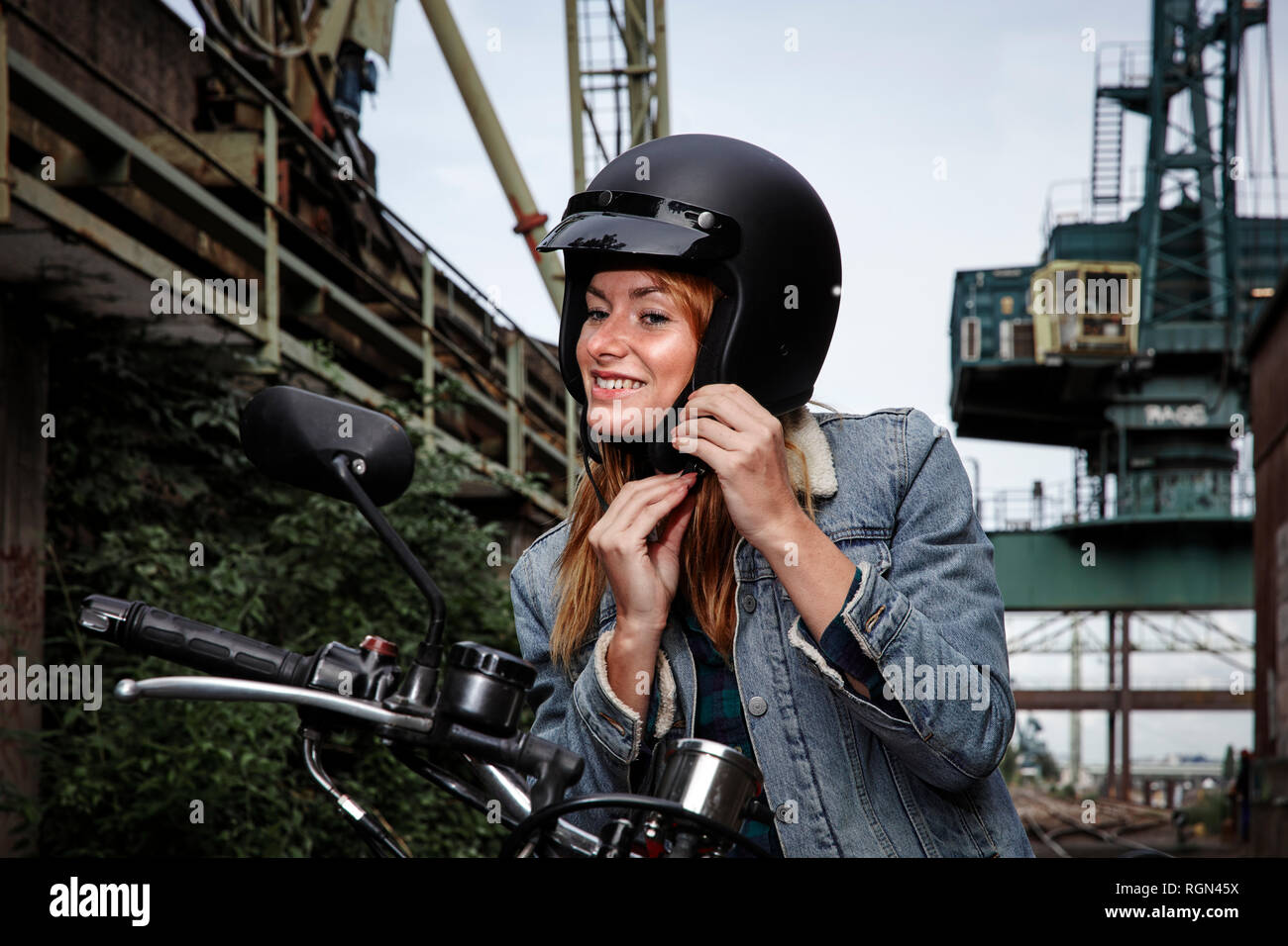 Putting on motorcycle helmet hires stock photography and images Alamy
