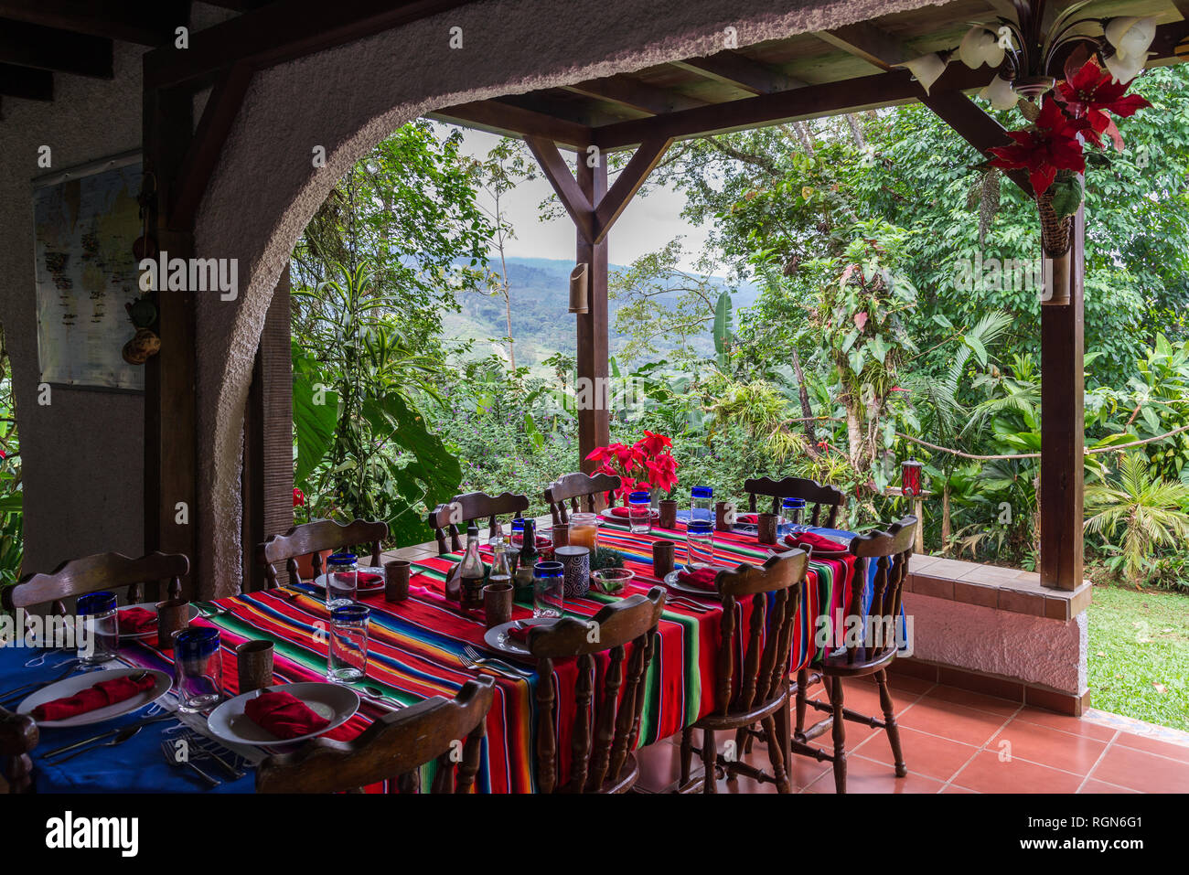 Dinning tables with colorful table cloth at an eco-lodge. Costa Rica, Central America. Stock Photo