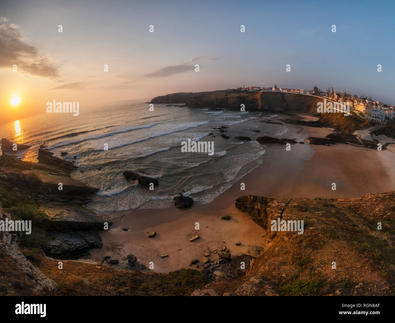 Portugal, Alentejo, Zambujeira do Mar, Praia dos Alteirinhos, rock formations at the beach in the evening Stock Photo