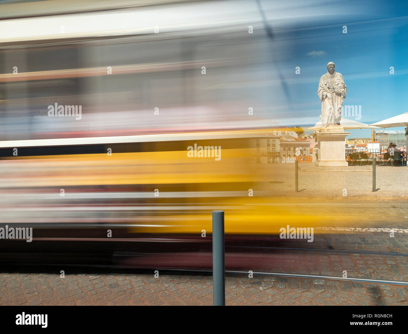Portugal, Grande Lisboa, Lisbon, moving tram and statue of Vincent of Saragossa Stock Photo