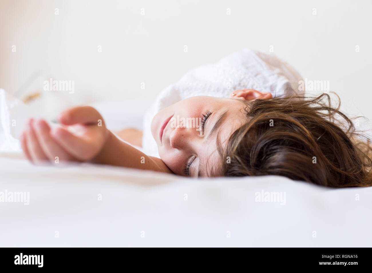 Little girl sleeping in bed Stock Photo - Alamy