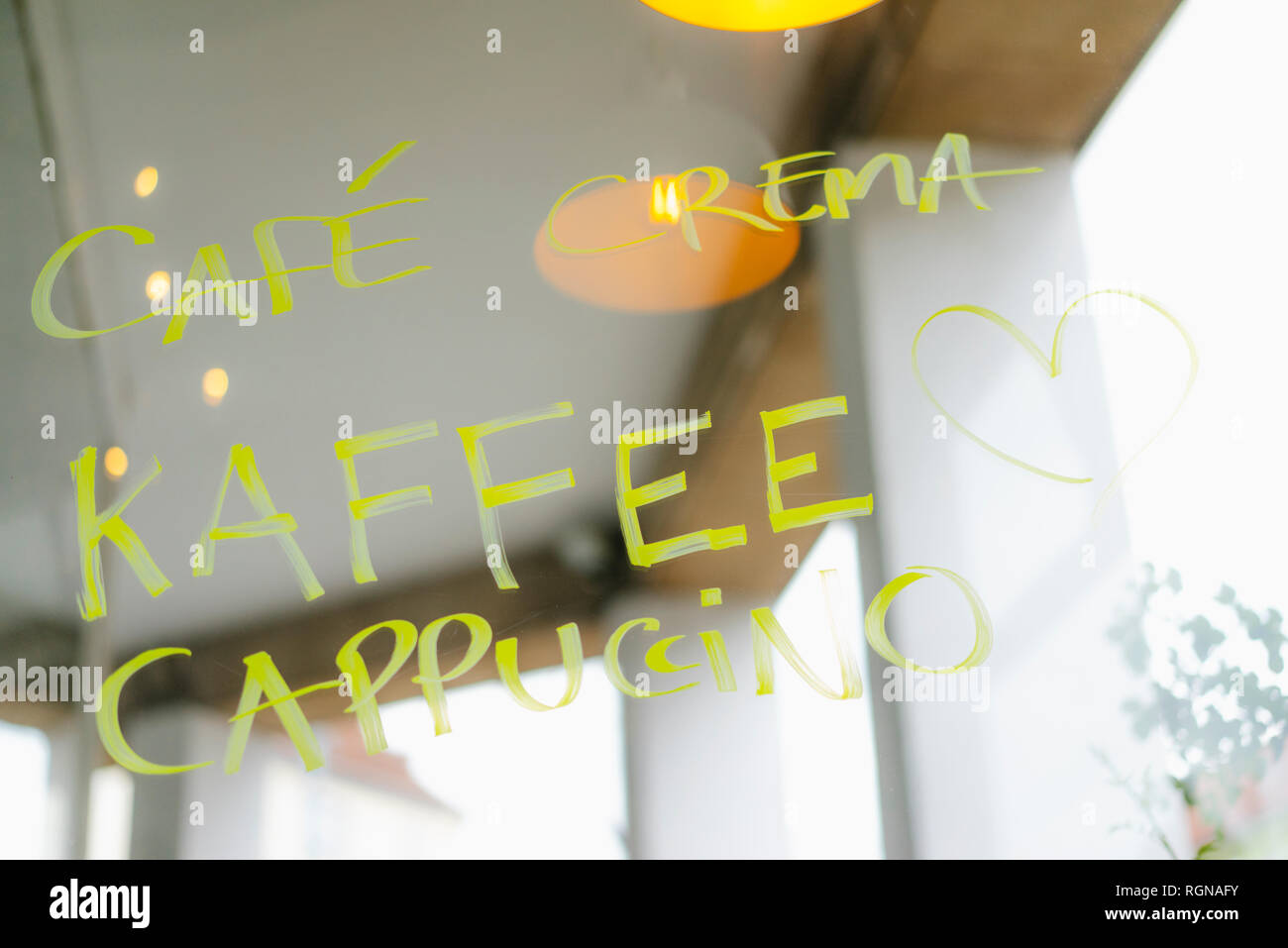 Handwritten offer on windowpane in a cafe Stock Photo
