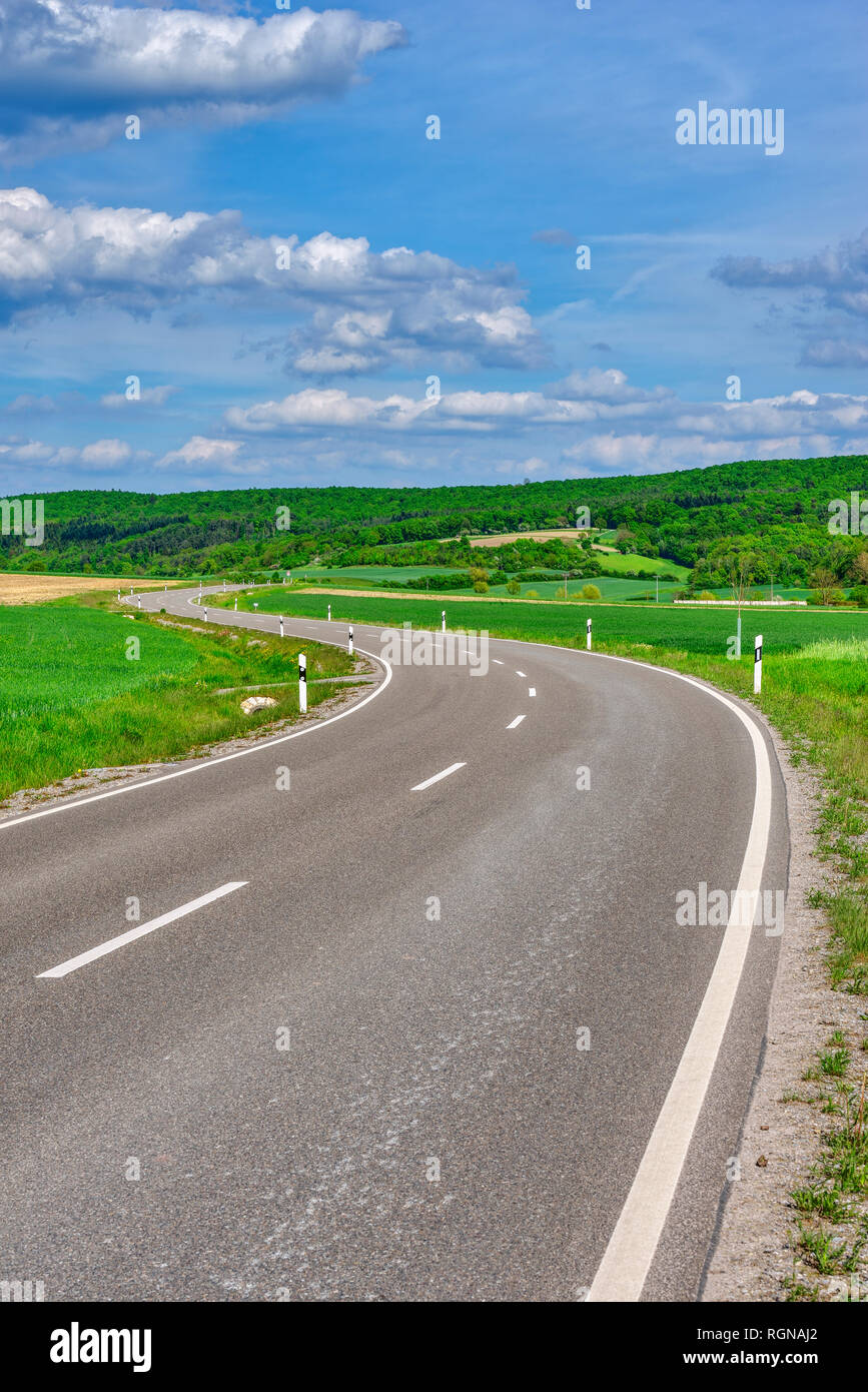 Winding road in the countryside, Bavaria, Germany Stock Photo
