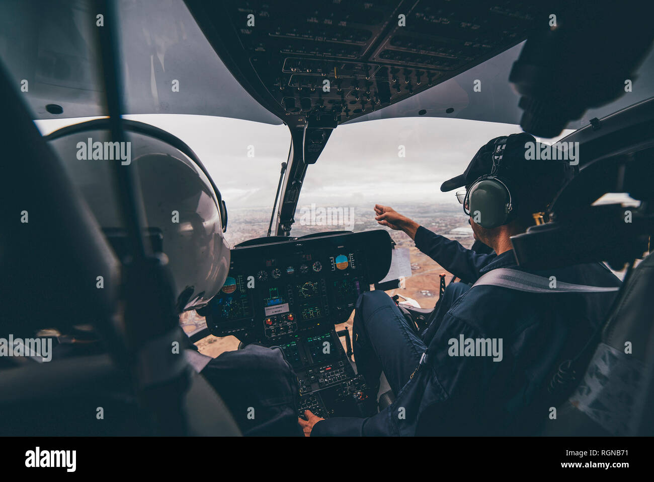 Police pilot during the helicopter flight Stock Photo