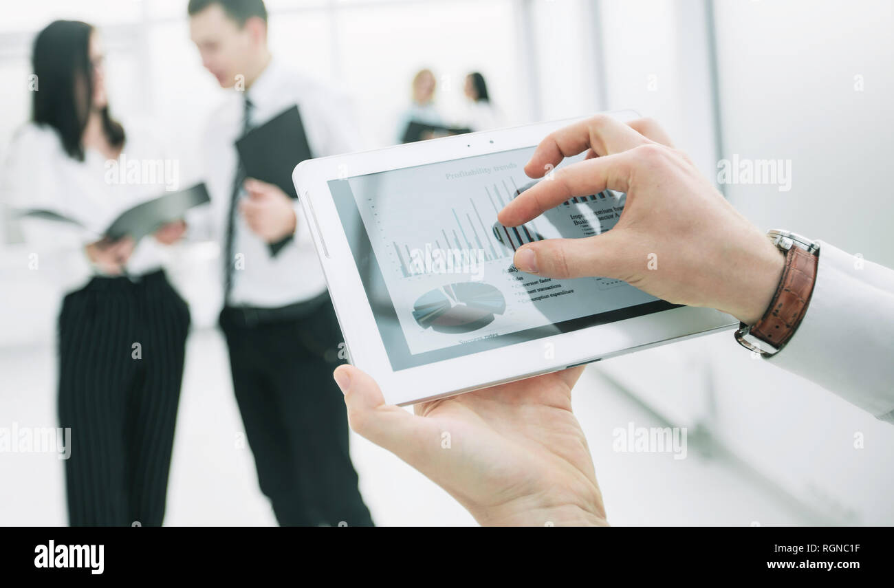 close up. digital tablet in the hands of a businessman. Stock Photo
