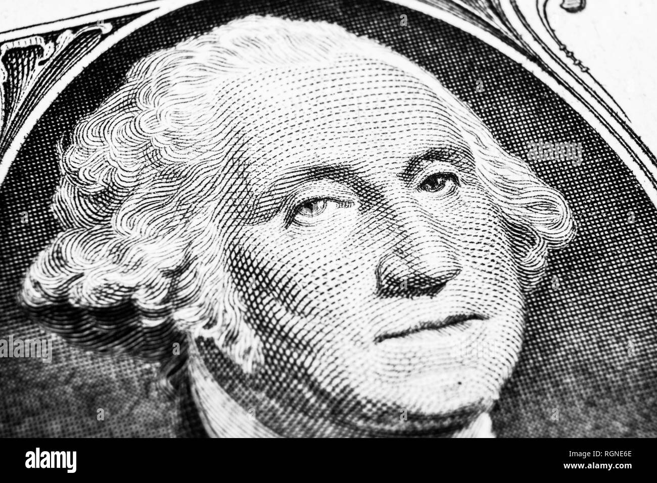 US president George Washington face portrait on the USA one dollar note. Macro shot. Background of the money. George Washington eyes macro shot. Black Stock Photo