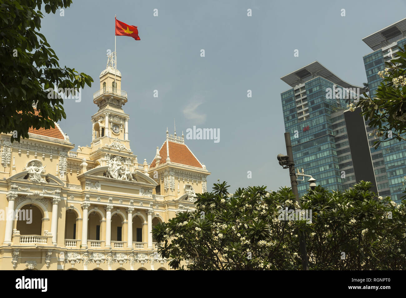 Vietnamese flag on the top of government building in Ho Chi Minh Stock Photo