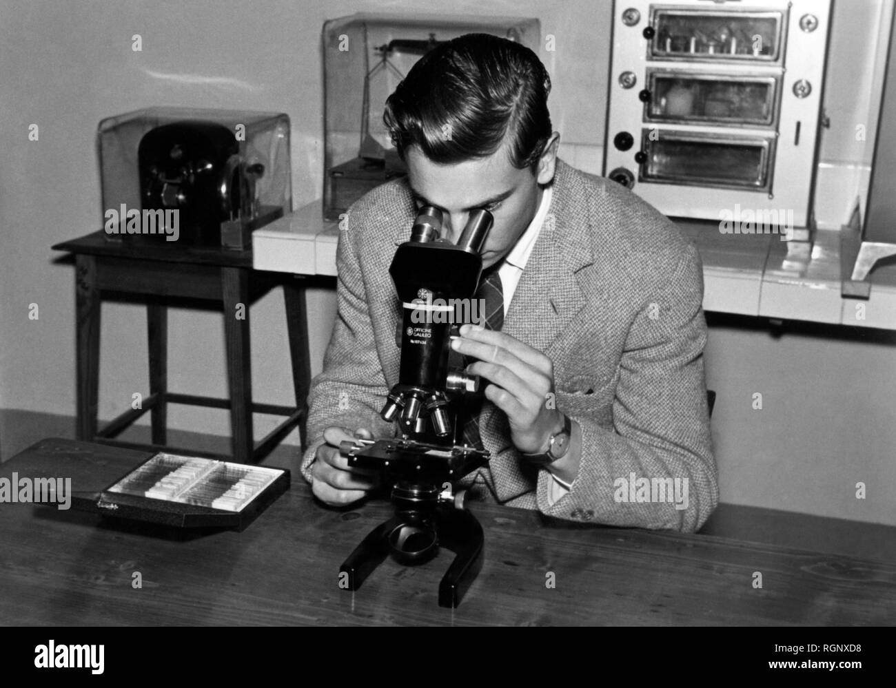 man, microscope, 1957 Stock Photo