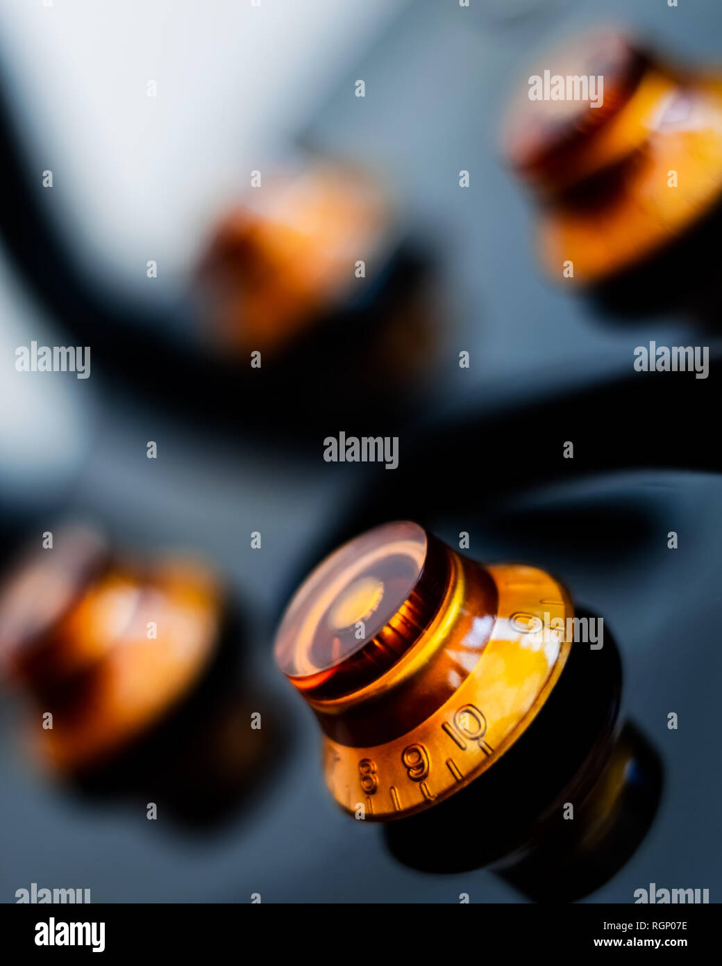 Close up on the volume and tone dials of an electric guitar vertical Stock Photo Alamy