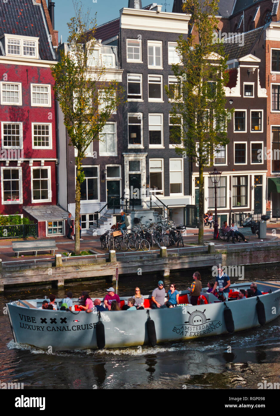 Luxury canal cruise and canal houses, Amsterdam, Netherlands, Europe Stock Photo