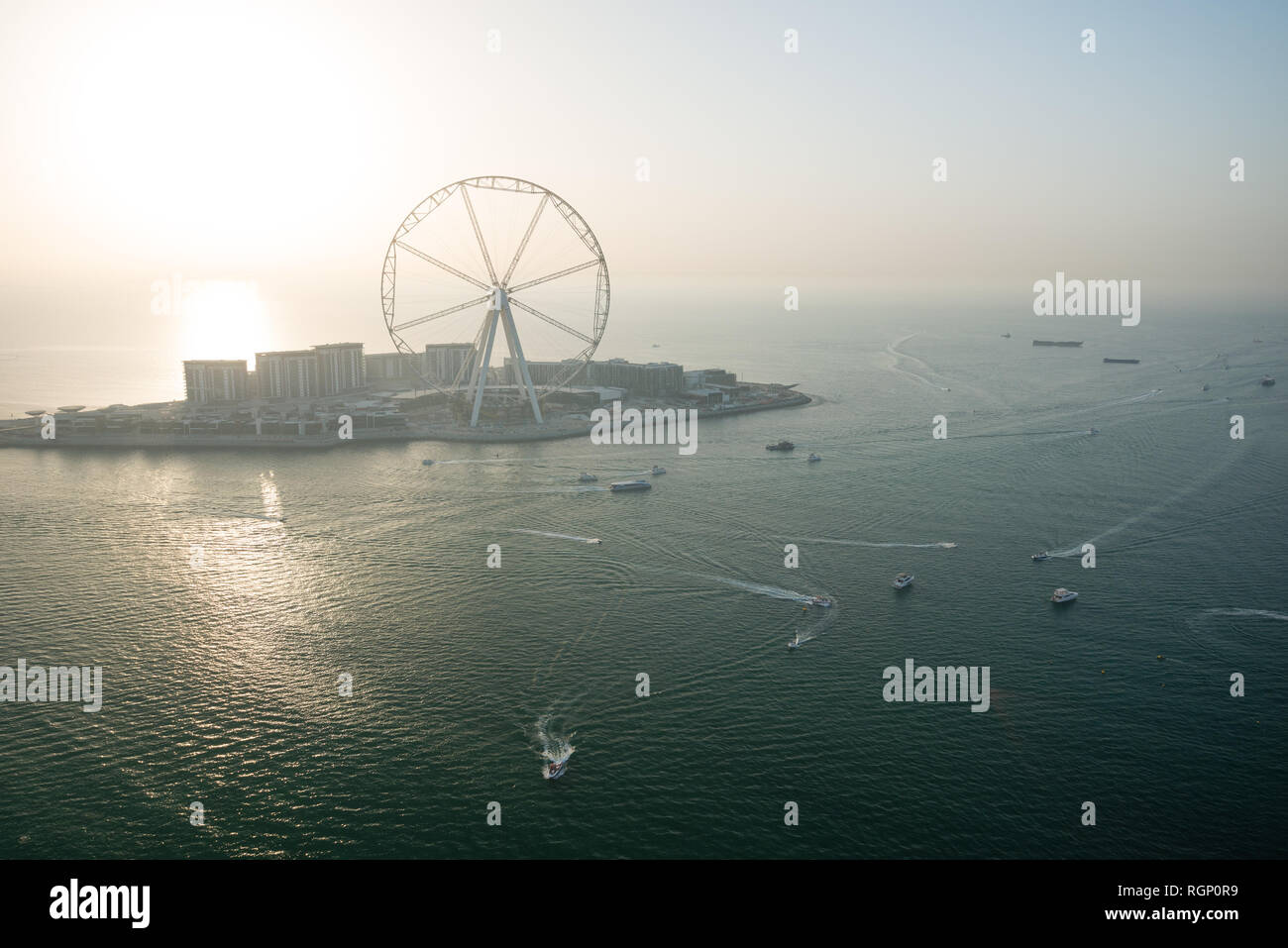 DUBAI, UAE - February 16, 2018: Aerial view of the Dubai Eye and the huge Ferris Wheel that should soon become main attraction on Bluewaters Island in Stock Photo