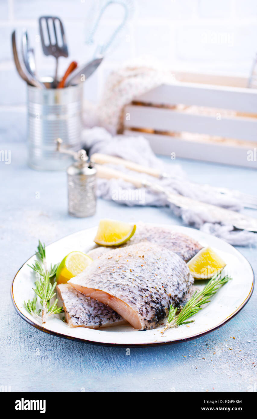 Fresh fish, raw cod fillets with rosemary and salt Stock Photo Alamy