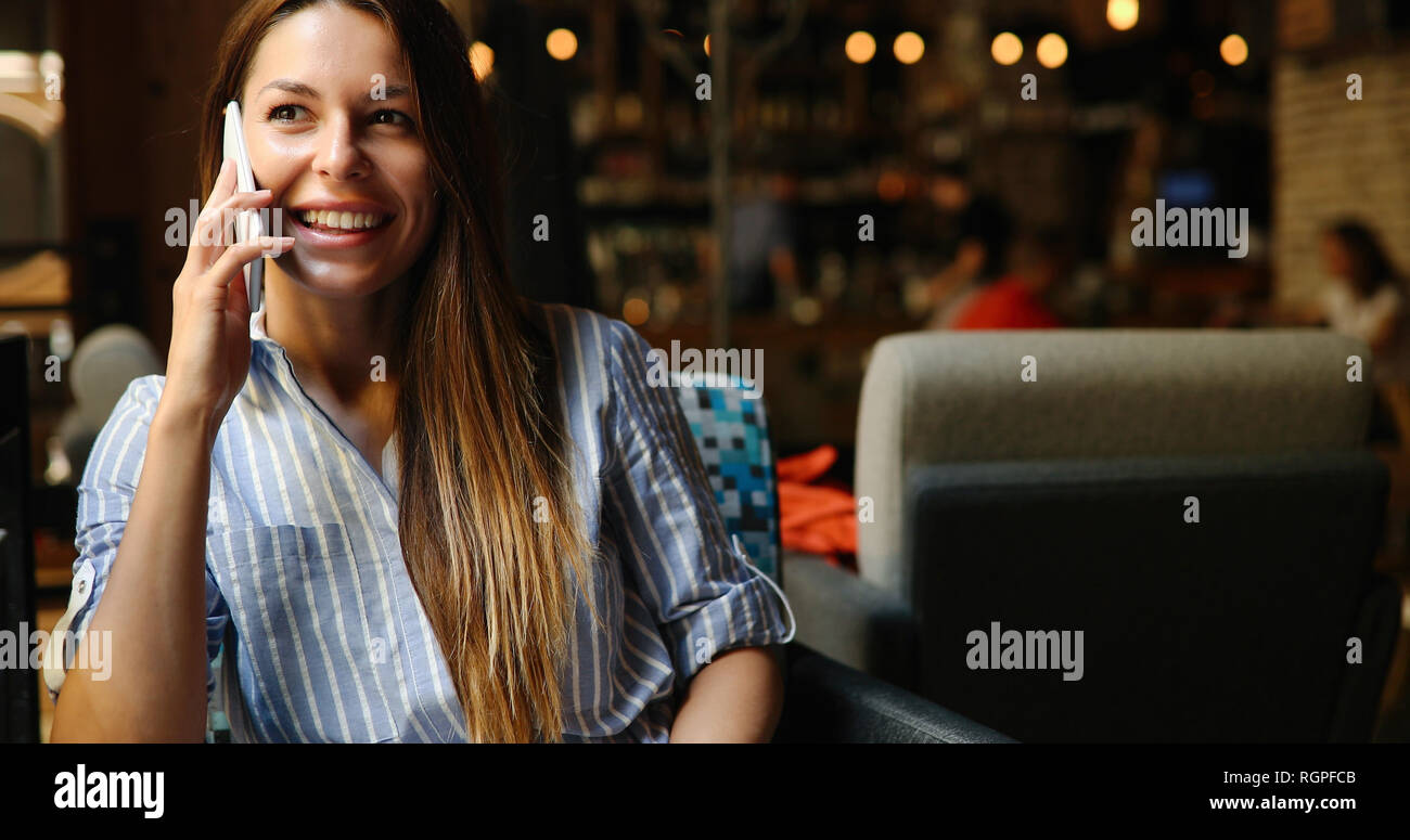 Portrait of young beautiful woman in blue dress Stock Photo - Alamy