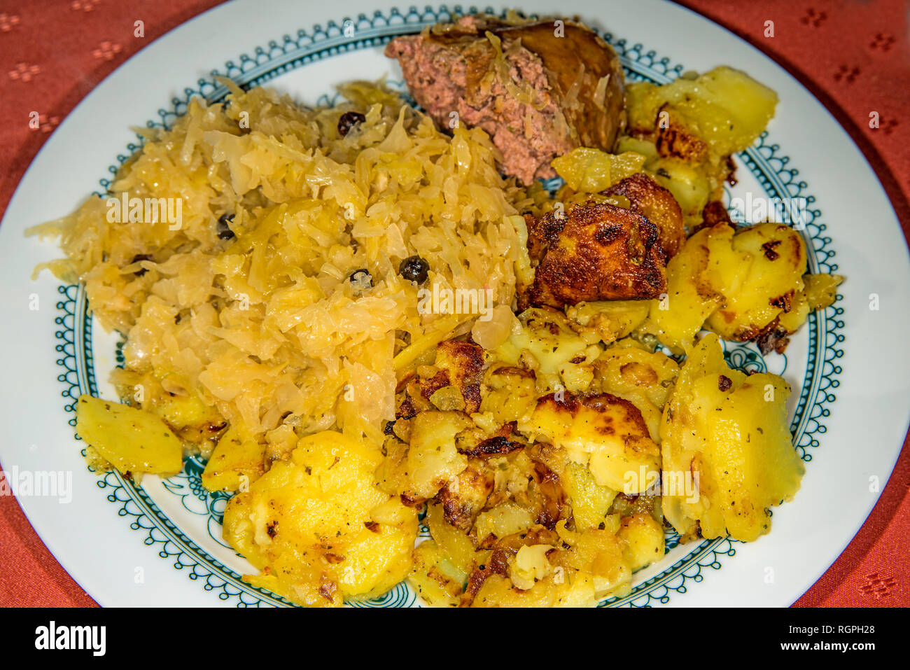 German deli Sauerkraut with liver sausage and roasted potatoes Stock Photo