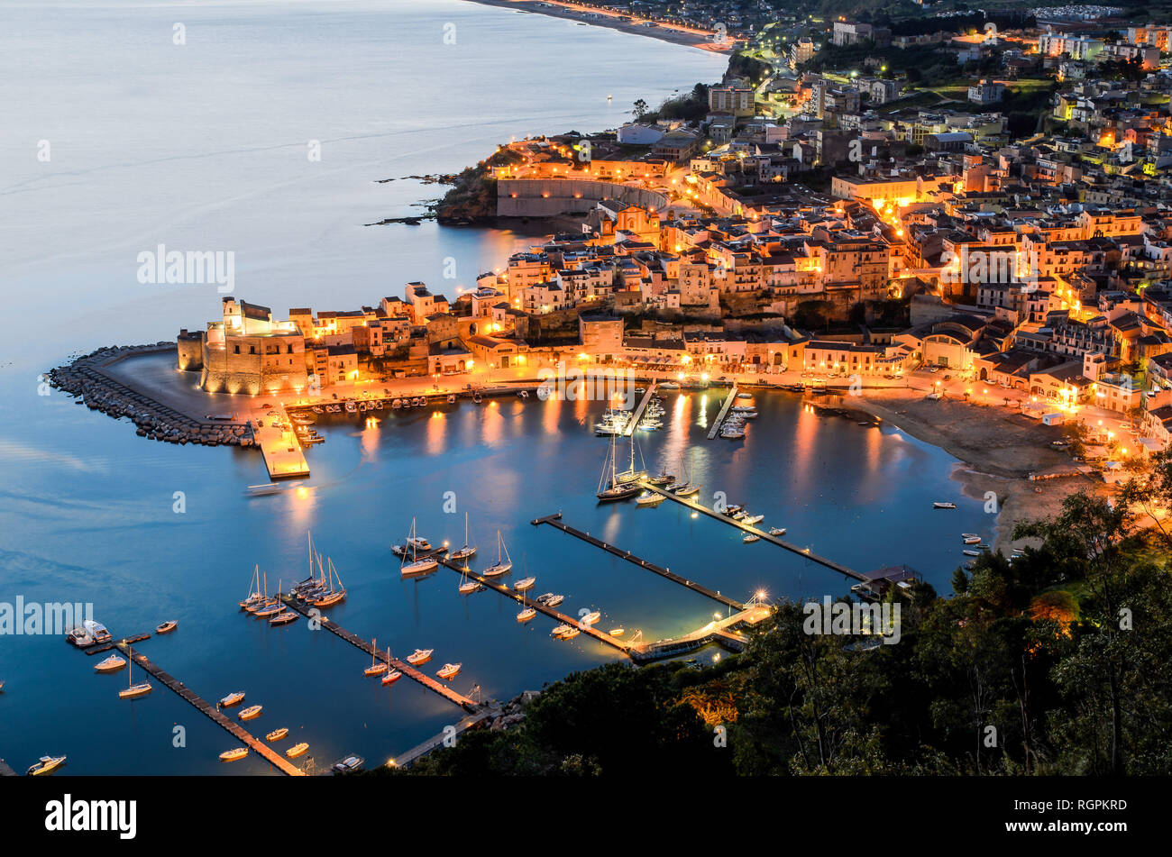 The town of Castellammare del Golfo with its castle and street lit up at  dawn, Province of Trapani, Sicily Stock Photo - Alamy