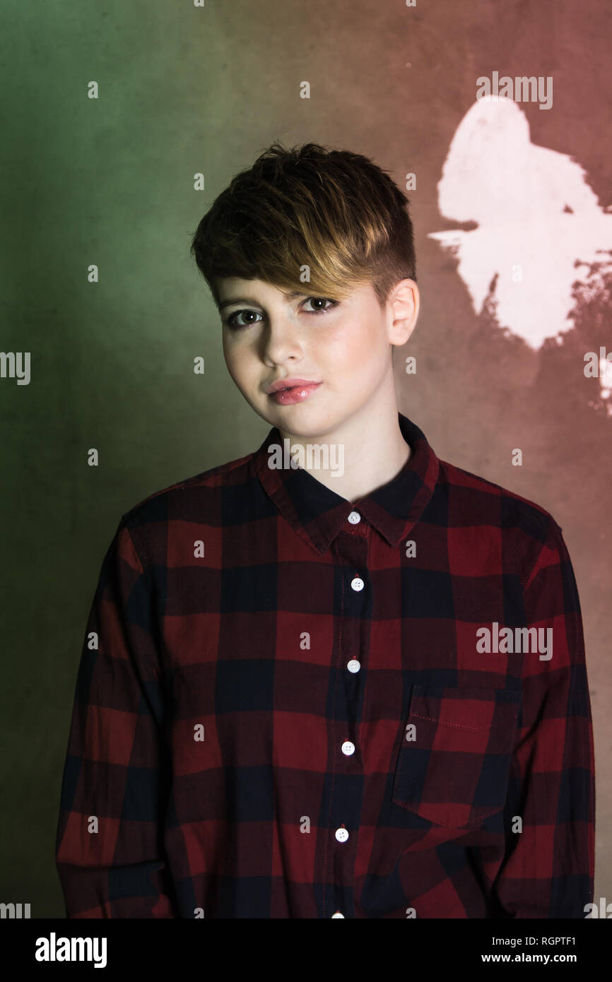 Teenager Girl With Short Haircut Concrete Wall On Background