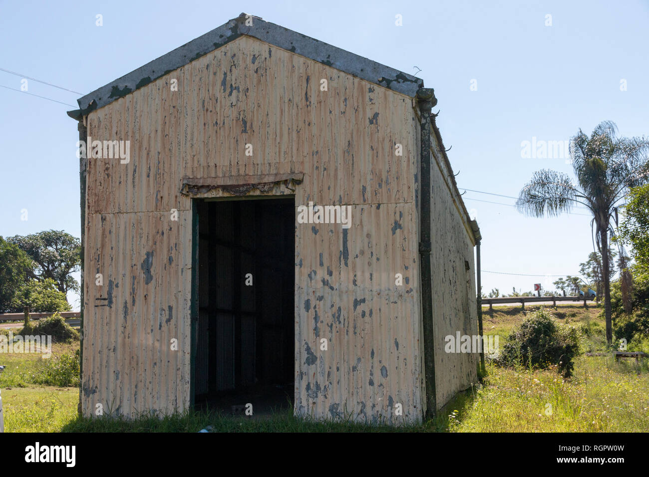 A Close Up Front View Of A Old Rusted Run Down Metal Barn Or