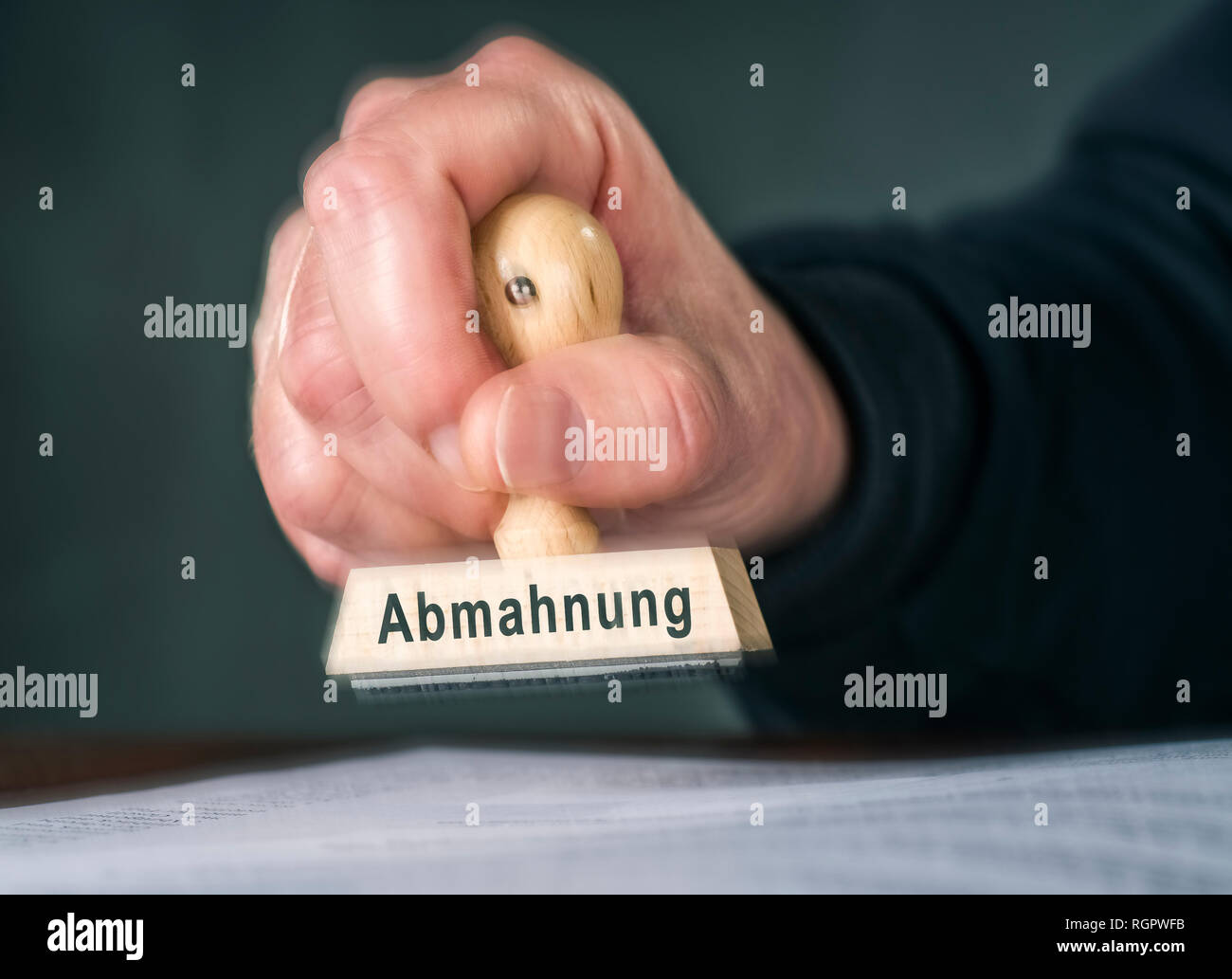 Hand with a stamp with the word dissuasion Stock Photo