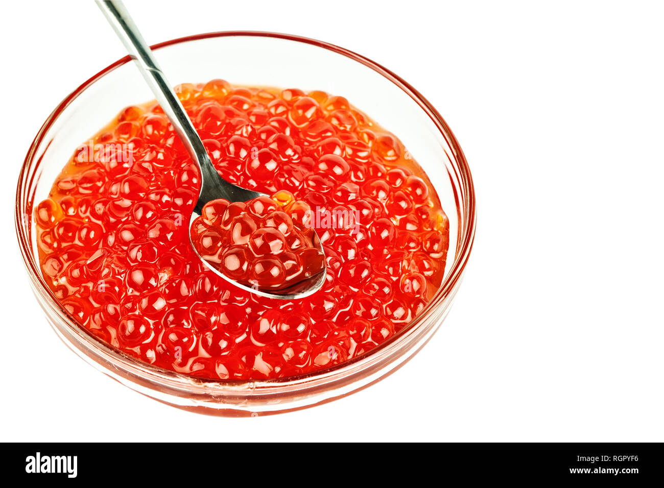 Red caviar in a glass container. Isolated object on white background. Stock Photo
